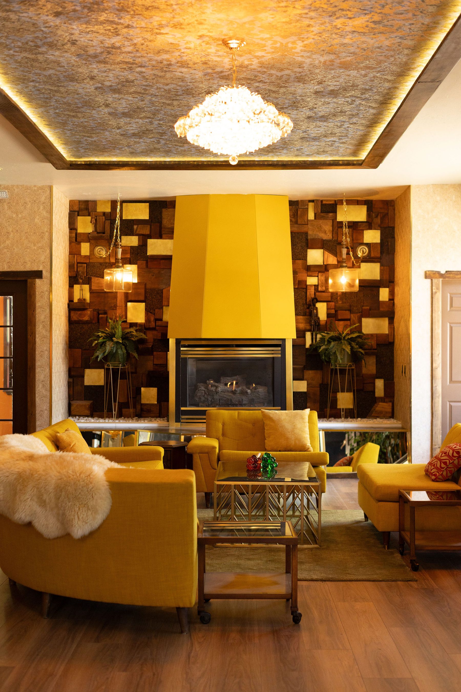 Yellow chesterfield + fireplace